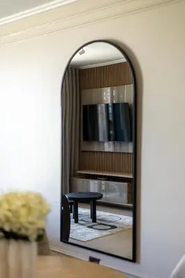 a mirror in a room with a table at Luxe 4608 Ellipse Waterfall in Midrand