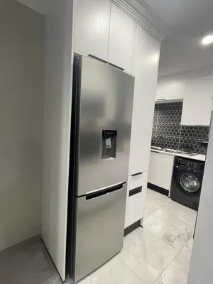 a stainless steel refrigerator in a kitchen at Omega 8 in Polokwane