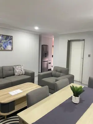 a living room with a couch and a table at Omega 8 in Polokwane