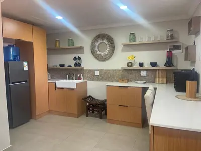 a kitchen with a sink and a counter top at Heart Of The Cosmos in Hartbeespoort