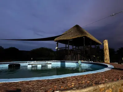 a small swimming pool with a gazebo at Sundara Safaris