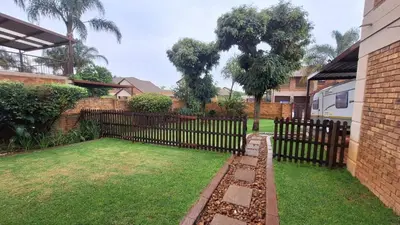 a fence in the yard of a house at Secure house in complex near OR Thambo airport in Johannesburg