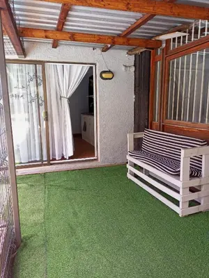 a room with a green floor and a mirror at The Tranquility Suite & Spa in Kempton Park