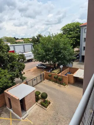 a view of a parking lot from a balcony at Elegant studio apartment in Hillcrest in Pretoria
