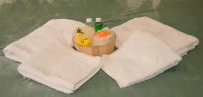 a cupcake sitting on top of two towels at Guesthouse Charis in Pretoria