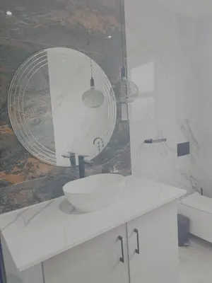 a bathroom with a white sink and a mirror at Kambula Villa 374 Euphoria in Naboomspruit