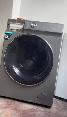 a washing machine with a black door on top of it at Lani Accommodation in Pretoria