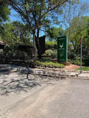 a sign on the side of a road next to a street at Lani Accommodation in Pretoria