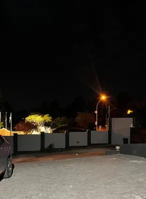 a car parked in a parking lot at night at Lani Accommodation in Pretoria
