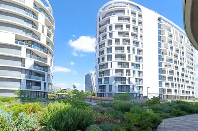 two tall buildings with a garden in front of them at Thango Executives Gallileo Ellipse in Midrand