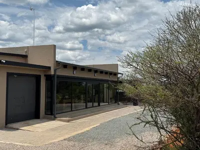 a building with a lot of windows on the side at Blessed Lodge at Ingilozi Mabalingwe in Warmbaths