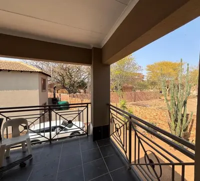 a balcony with a view of a yard at Divine apartments in Polokwane