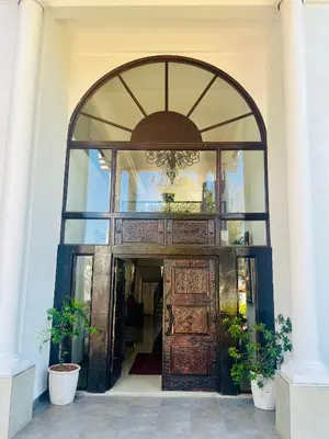 an entrance to a building with a large wooden door at 165 Neptune Waterkloof Pretoria in Pretoria
