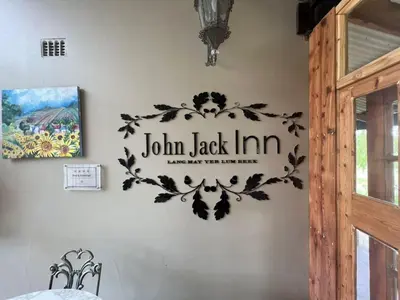a sign on the wall of a room at John Jack Inn Accommodation in Lake Chrissie
