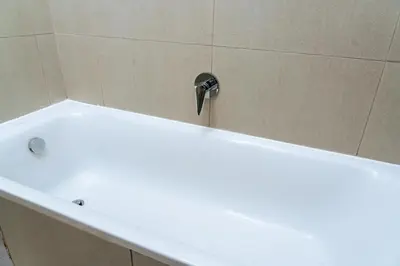 a bath tub with a faucet on top of it at Fully Equipped Modern 2-Bedroom in Midrand