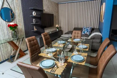 a dining room with a table and chairs at Fully Equipped Modern 2-Bedroom in Midrand