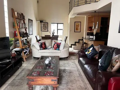 a living room with a couch and a coffee table at Mona Lisa No5 in Polokwane