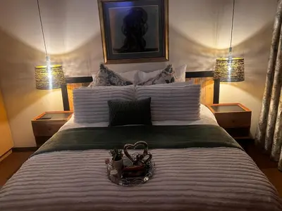 a bedroom with a large bed with a basket on it at Mona Lisa No5 in Polokwane