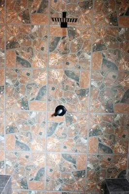 a computer mouse sitting on top of a stone wall at Pecan and Lime Inn The First Den in Pretoria