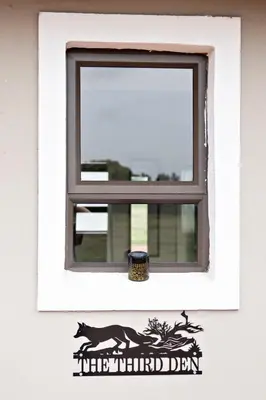 a window with a horse decal on a white wall at Pecan and Lime Inn The First Den in Pretoria