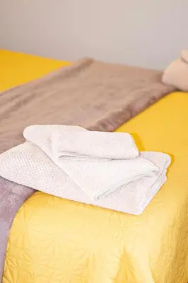 a pair of white towels sitting on top of a bed at Pecan and Lime Inn The Second Den in Welbekend