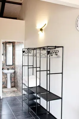 a black bunk bed in a bathroom with a sink at Pecan and Lime Inn The Second Den in Welbekend