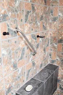 a bathroom with a stone shower with a toilet at Pecan and Lime Inn The Second Den in Welbekend