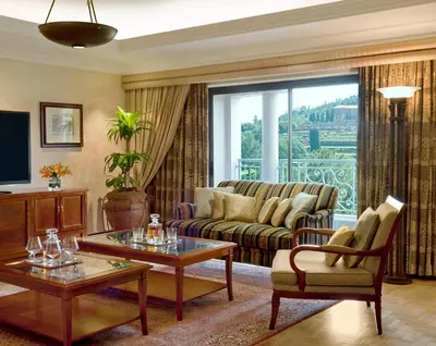 a living room with a couch and a table at CT Hotel in Pretoria
