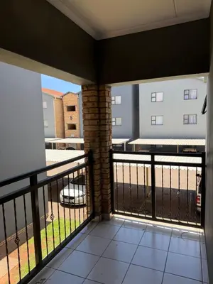 a balcony with a view of a building at Your easy stay OR Tambo in Kempton Park