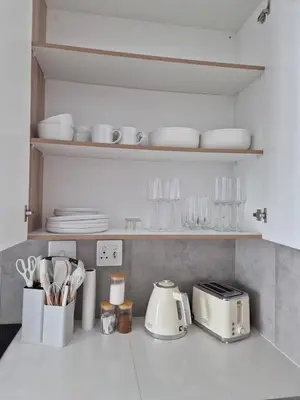 a kitchen counter with a toaster and utensils at Village Vista at Atlasville 10km from OR Tambo in Boksburg