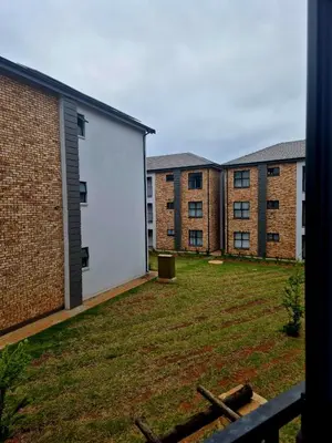 a view of the courtyard of an apartment complex at Village Vista at Atlasville 10km from OR Tambo in Boksburg