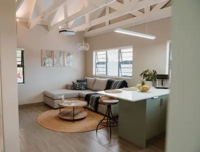 a living room with a couch and a table at Plekkie Sonder Die See in Centurion
