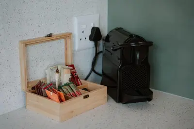 a wooden box sitting next to a coffee maker at Plekkie Sonder Die See in Centurion