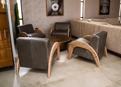 a living room with two chairs and a couch at Villa On 59 in Giyani