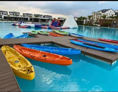 a group of kayaks and boats in a pool at The Blyde Luxury Apartment in Pretoria
