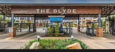 a bus stop with a sign that reads the bridge at The Blyde Luxury Apartment in Pretoria