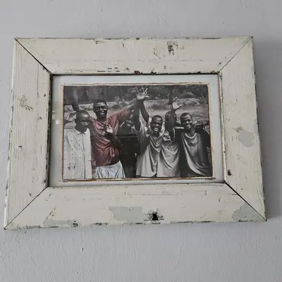 a picture of a group of men in a wooden frame at 14 Isabel in Centurion