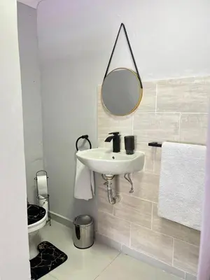 a bathroom with a sink and a mirror at 14 Isabel in Centurion