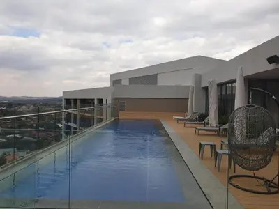 a swimming pool on the roof of a building at Menlyn Maine Trilogy Apartment 1220 & 1221 in Pretoria