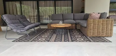 a living room with a couch and two chairs at Krek Wak Wou Bush Villa in Marloth Park