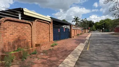 a brick building on the side of a street at Entire Premises ideal for large groups and reunions in Pretoria