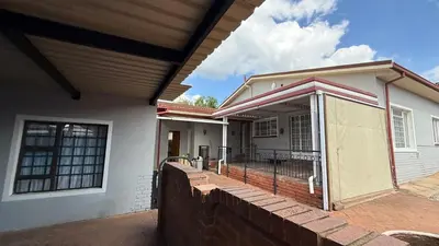 a home under construction with a covered porch at Entire Premises ideal for large groups and reunions in Pretoria