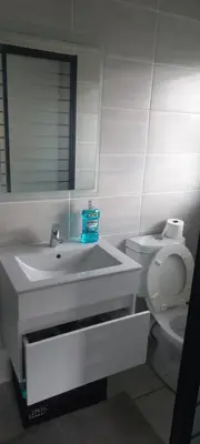 a bathroom with a sink and a toilet at Waterfall Midrand in Northdene