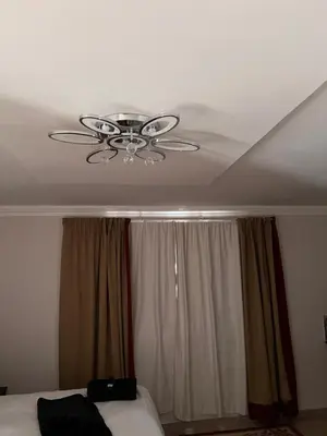 a ceiling fan in a bedroom with a window at MorningMist Boutique 27 Dawie de Villiers Room 3 in Centurion