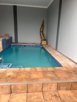 a swimming pool with a snake in a room at MorningMist Boutique 27 Room 5 in Centurion