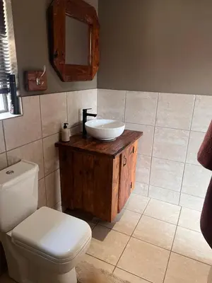 a bathroom with a sink and a toilet at MorningMist Boutique 27 Room 5 in Centurion