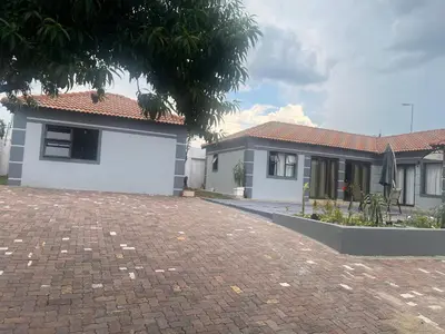 a house with a brick driveway in front of it at Morningmist Boutique 27 Room 3 in Centurion