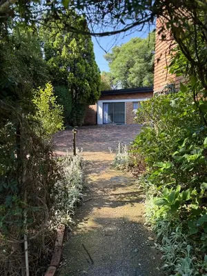 a driveway leading to a house with a garage at Tambo Touchdown Suites in Benoni