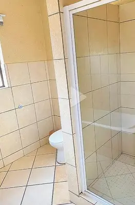 a bathroom with a toilet and a shower at 2 Heron street,stonenge vidago 6 in Nelspruit