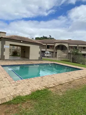 a swimming pool in front of a house at 2 Heron street,stonenge vidago 6 in Nelspruit